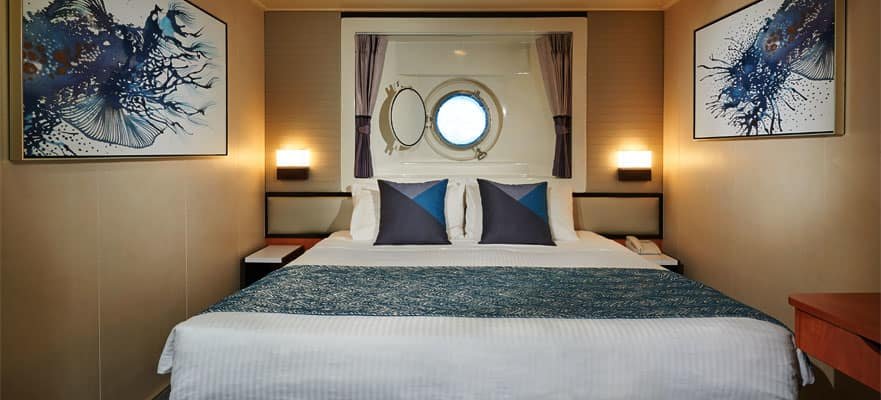 Каюта з вікном «Mid-Ship Oceanview Porthole Window Stateroom»